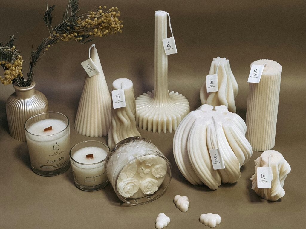 ๐ 5 Lifestyle Essentials Every Book Lover Needs A collection of intricately designed sculpted candles in various shapes, perfect for decor.